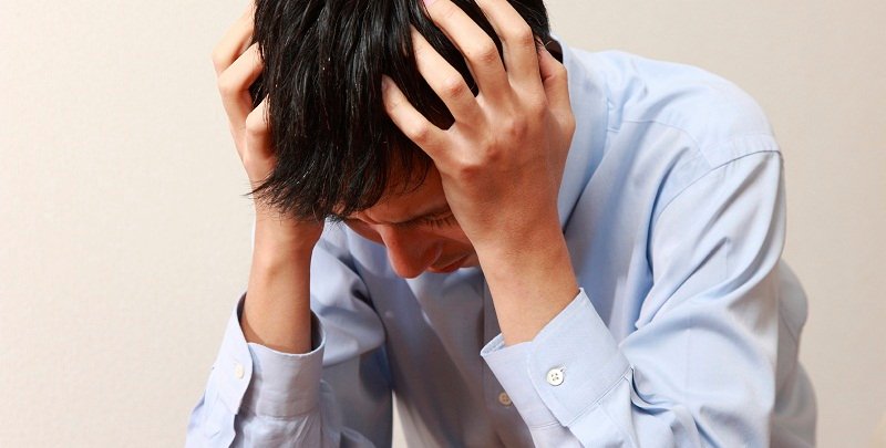 Person appearing tired and stressed